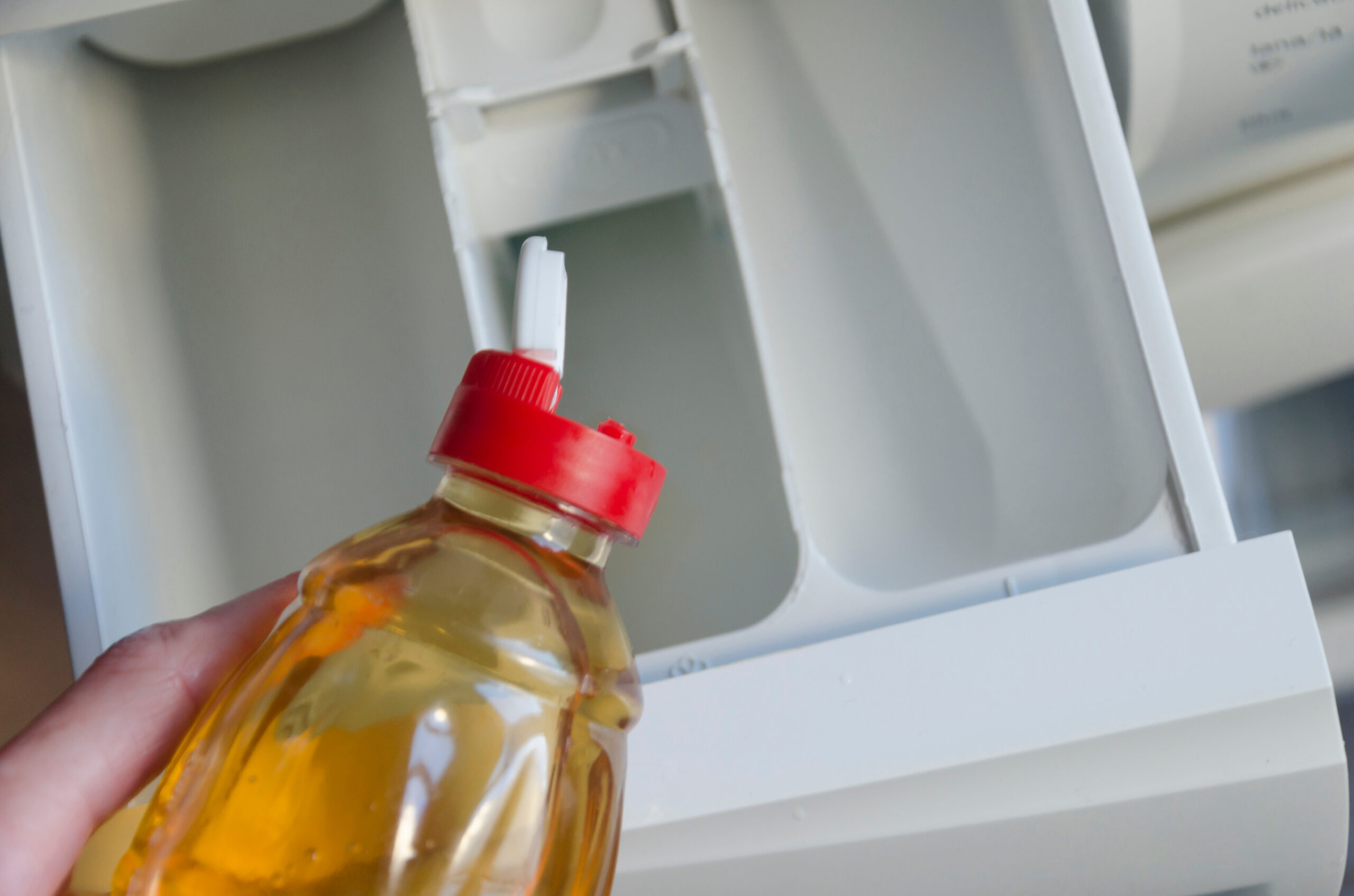 Vinegar in washing machine detergent tray. | SHW Blog